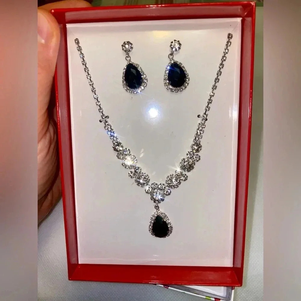 New in a box jewelry set. Metal is unknown